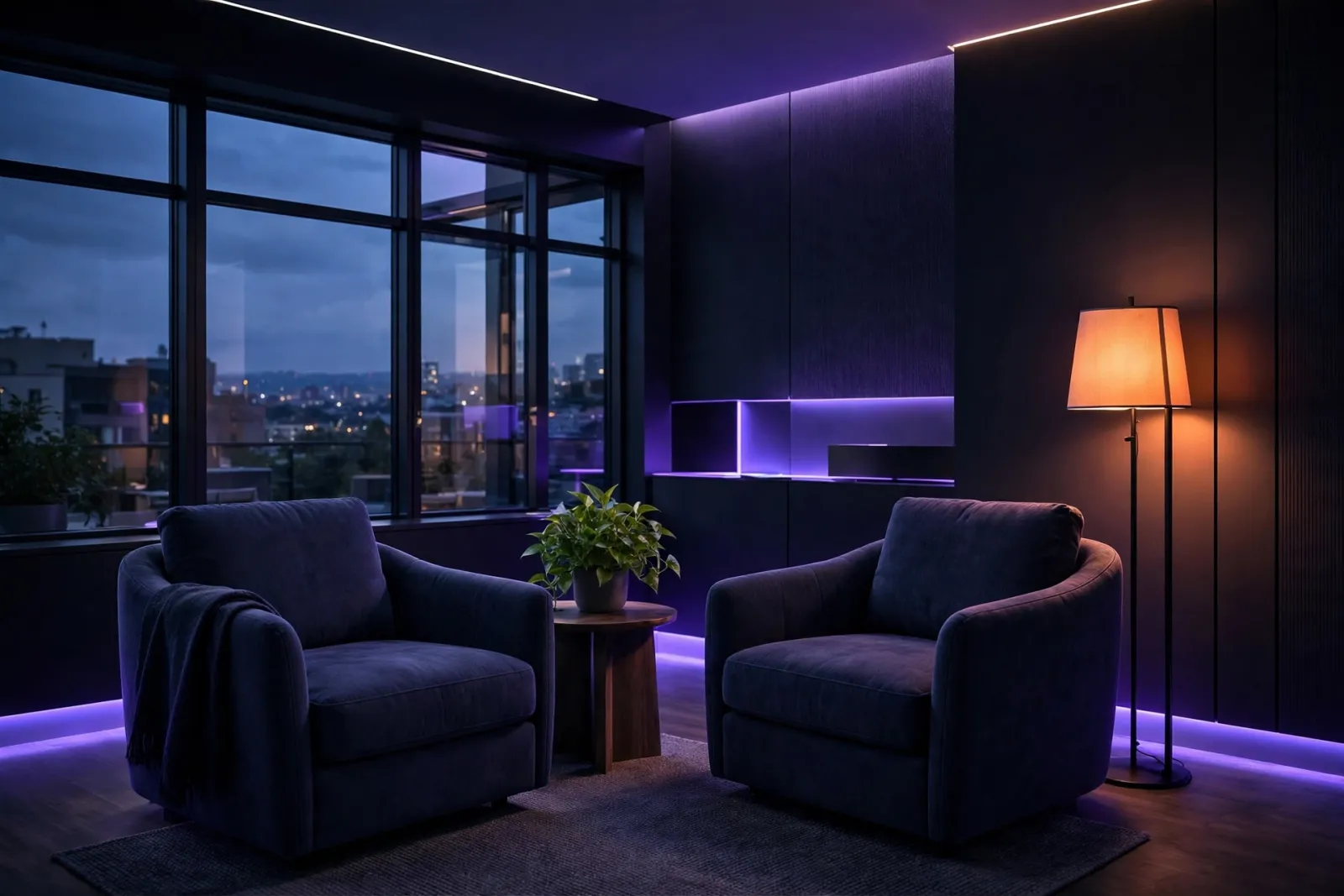 A calm, modern therapist's office with two facing armchairs, a softly glowing floor lamp, and evening dusk light through a la
